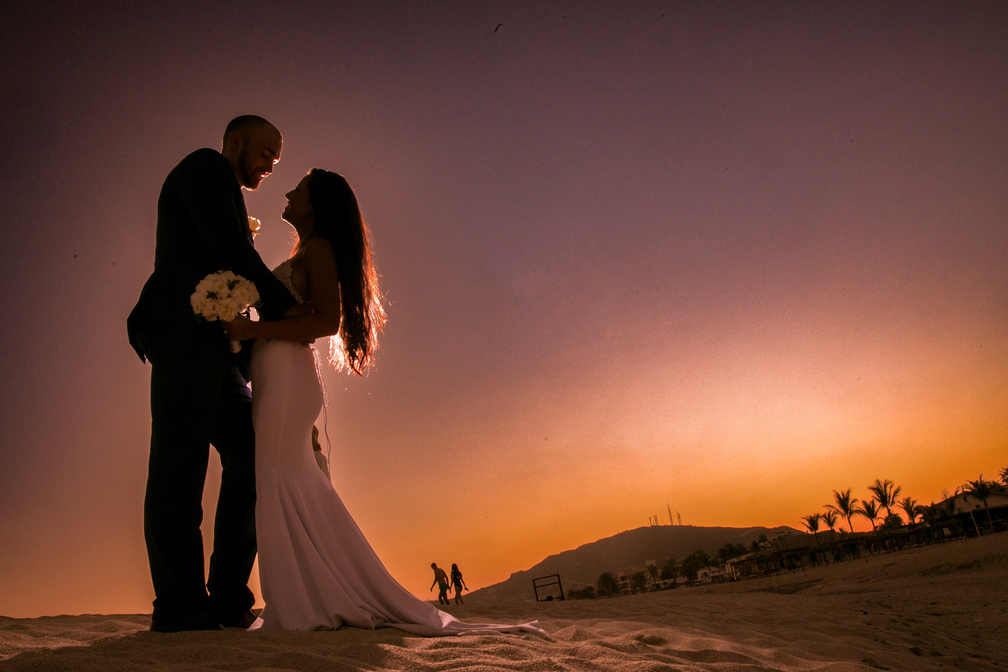 Cabo wedding photographer- couple with sunset on beach